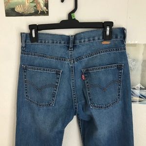 Blue Levi’s 550 relaxed fit jeans.